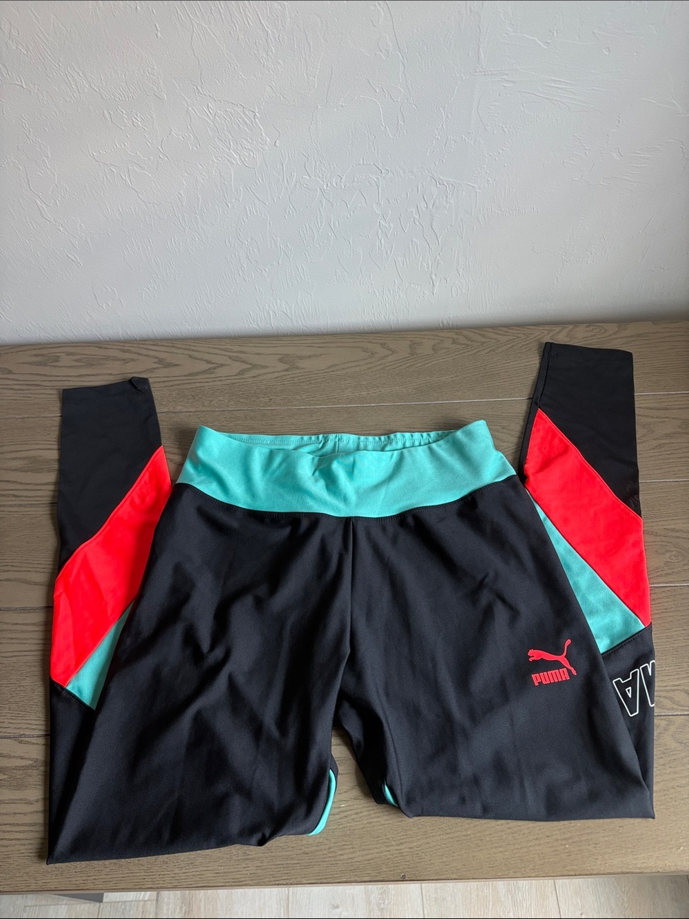 Puma Black Leggings with Turquoise Waistband and Red Side Panels